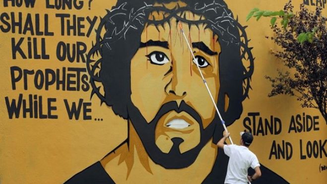 Retrato de Luaty Beirão no “muro das Amoreiras” para dar força ao ativista luso-angolano